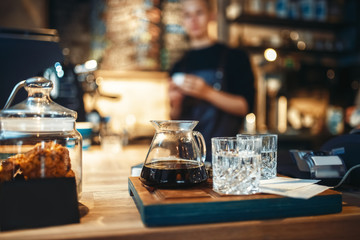 Glasses with black coffee and filtered water