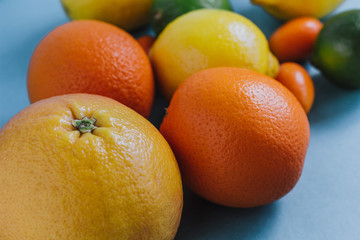 Citrus fruits on a blue table background. selective focus.