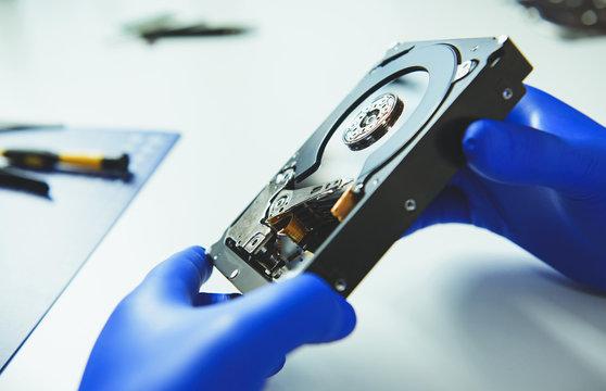 Close up of male hands with HHD at workplace