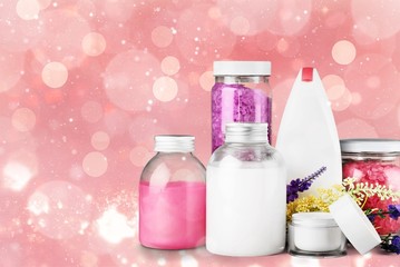 Cosmetic containers on wooden desk