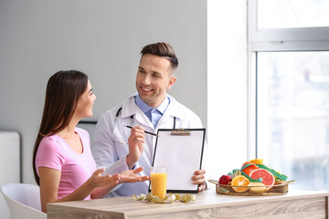 Young woman visiting nutritionist in weight loss clinic