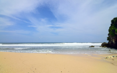 waves on the beach with beautiful white sand and blue sky background