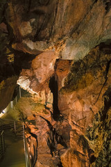 A footbridge allows you to visit the beautiful rock formations of the Antro del Monte Corchia cave in the Apuan Alps in Italy.
