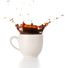 coffee splashing out of a cup isolated on white background
