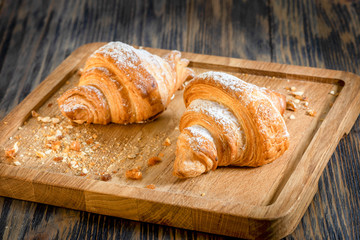 croissants with jam on a wooden backing