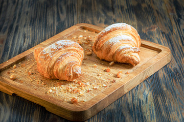 croissants with jam on a wooden backing
