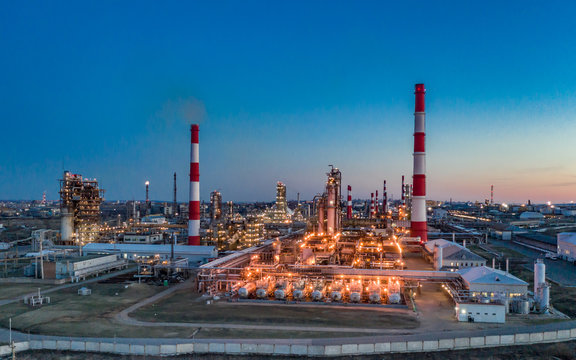 Russia. Ufa. April 2019. Башнефть Bashneft Flying above  chemical factory (refinery) in the late evening. Lights of night Ufa.