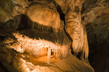 The beautiful stalactites and stalagmites and other rock formations are reflected in a small lake in the Antro del Monte Corchia cave in the Apuan Alps in Italy.