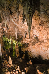 The beautiful stalactites and stalagmites and other rock formations are reflected in a small lake in the Antro del Monte Corchia cave in the Apuan Alps in Italy.