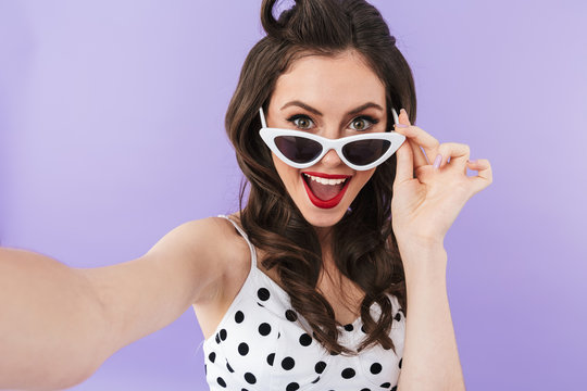 Portrait Of Stylish Pin-up Woman 20s In Retro Sunglasses Smiling While Taking Selfie Photo