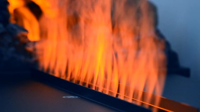 Artificial electrofireplace glowing backlight close-up.