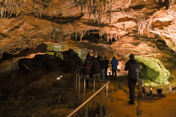 LEVIGLIANI, ITALY - JUNE 05, 2016: Some visitors admire the stalactites of the Antro del Monte...