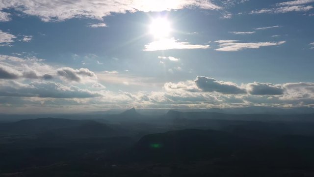 amazing view over the Pic Saint Loup Mountain in France sunny day aerial shot of the sky with clouds