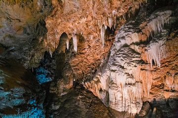 The beautiful stalactites and stalagmites and other rock formations are reflected in a small lake in the Antro del Monte Corchia cave in the Apuan Alps in Italy.