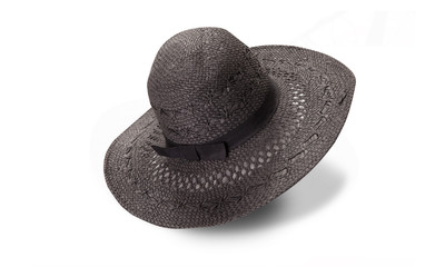 Pretty straw hat with ribbon and bow on white background. Beach hat top view isolated