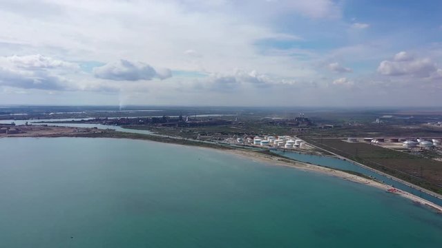 Mediterranean shore France petroleum refinery Fluid catalytic cracking gas and oil storage tanks aerial view sunny day