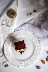 tasty chocolate authentic canadian dessert Nanaimo with nuts in healthy version - plant based and shugar free