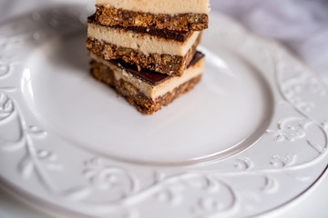 tasty chocolate authentic canadian dessert Nanaimo with nuts in healthy version - plant based and shugar free