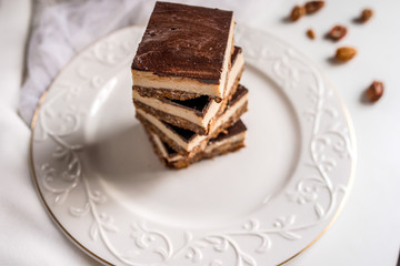 tasty chocolate authentic canadian dessert Nanaimo with nuts in healthy version - plant based and shugar free