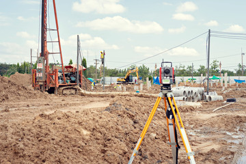 Surveyor equipment GPS system or theodolite outdoors at construction site.