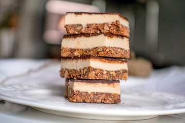 tasty chocolate authentic canadian dessert Nanaimo with nuts in healthy version - plant based and shugar free