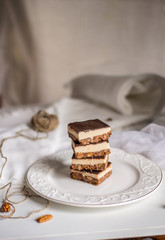 tasty chocolate authentic canadian dessert Nanaimo with nuts in healthy version - plant based and shugar free