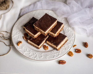 tasty chocolate authentic canadian dessert Nanaimo with nuts in healthy version - plant based and shugar free