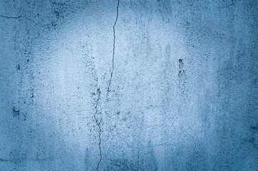 Background of blue casually superimposed concrete with vignetting.