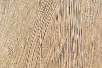 Look down at the truck trail on the sand, the ground, aerial view.