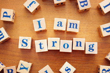 I am strong. Conceptual image with the text made from wooden cubes on a desk