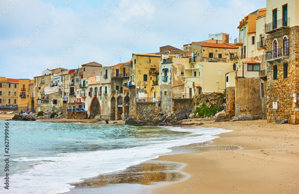 Poster old houses by the sea in cefalu