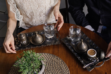 Turkish coffee and date in a coffee shop