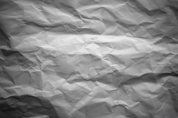 Crumpled gray paper with vignette background texture