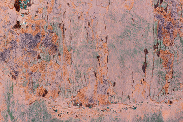 Old cracked rusty damaged painted metal background texture close-up