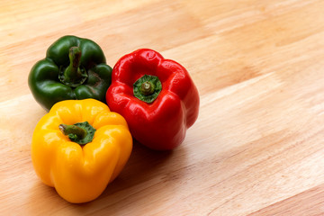 à¸´Bell peppers colorful on wood table