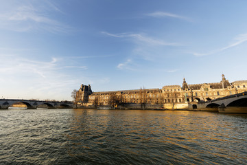 Fototapeta premium Louvre Palace near river Seine - Paris, France