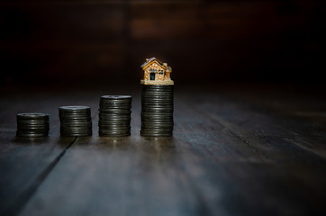 Small brown house Set on metals arranged in an orderly manner.
