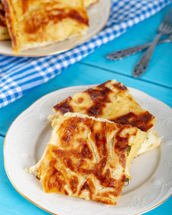 Su Boregi / Turkish Patty on wooden background.