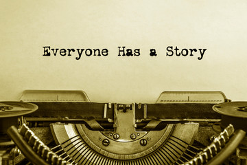 Everyone has a Story printed on a sheet of paper on a vintage printing machine. writer,journalist