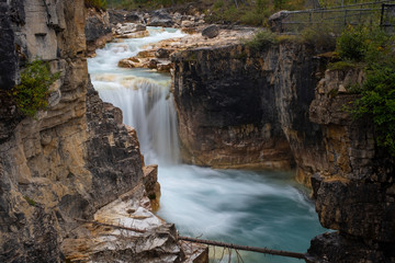 Marble Canyon Waterfall, Kootenay National Park, Canada in full force, taken with a long exposure to smooth out the water