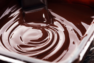 Melting chocolate, melted delicious chocolate for handmade praline icing confectionery