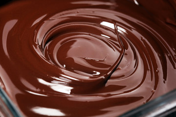 Melting chocolate, melted delicious chocolate for handmade praline icing confectionery