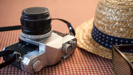 Camera sunglasses and a hat for travel