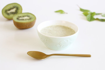 Healthy fresh kiwi smoothie with fresh fruits isolated on white background. Superfood, detox and healthy food.