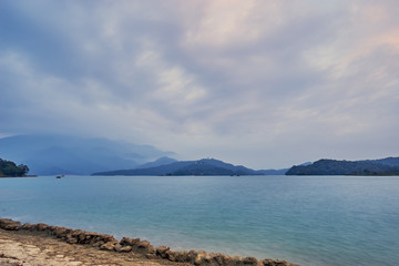 Beautiful sunset scenics of Sun Moon Lake with the surrounding mountains are the highlight at this sprawling lake at Yuchi, Nantou in Taiwan.