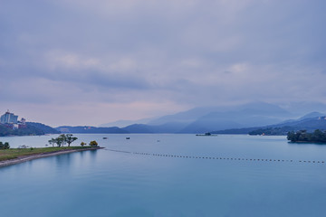 Beautiful sunset scenics of Sun Moon Lake with the surrounding mountains are the highlight at this sprawling lake at Yuchi, Nantou in Taiwan.