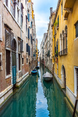 Fototapeta na wymiar Canal in Venice with traditional old houses, Italy