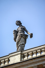 Statue on the roof of Palace on the Water also called Lazienki Palace in Royal Lazienki park in Warsaw, capital city of Poland