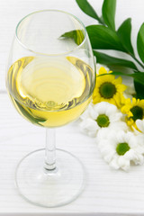 Glass of White Whine and Flowers