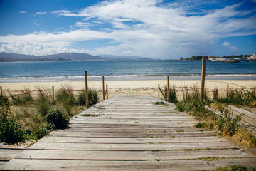 wooden bridge overlooking the ocean, beautiful view, sunny Spain